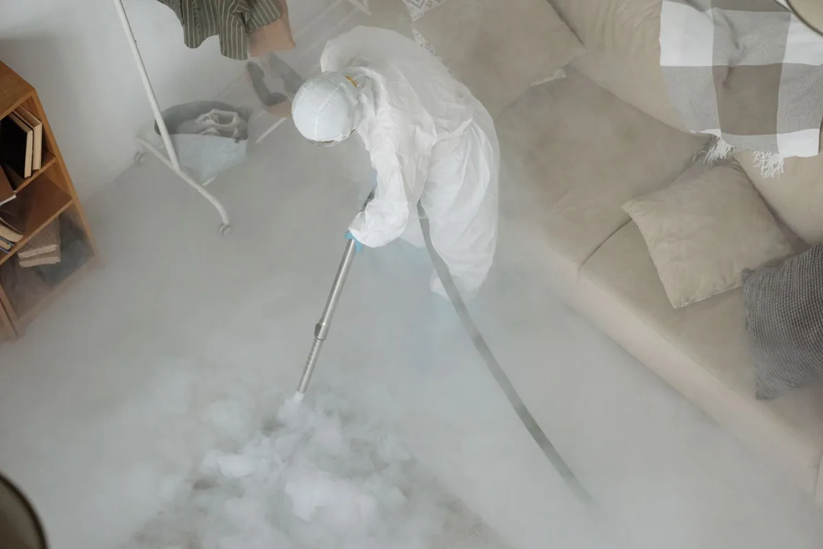 Biohazard cleanup technician in protective equipment, Black River, NY